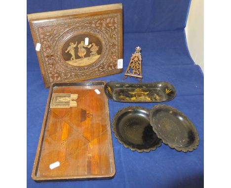 A Sorrento ware writing folder with pierced and marquetry inlaid figural decoration, a miniature treen ware easel, two papier