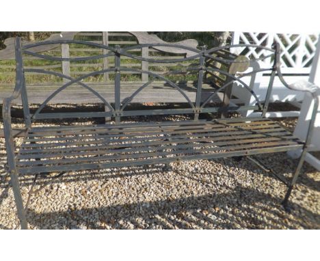 A Regency style wrought iron garden bench CONDITION REPORTS Approx 161cm wide.  Some weathering, rusting and flaking.  Appear