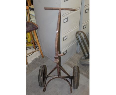 A vintage milk churn or bottle trolley, sold together with a vintage milk cooler and what appears to be an automobile radiato