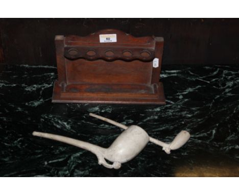 Two large clay pipes, the largest with printed name Robert Sinclair, Old Tobacco, Nun Street, Newcastle, together with a stai