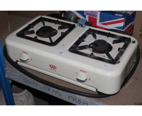 A Main 72B calor gas two ring hob, in cream enamel.  CONDITION REPORT: Some signs of use and some enamel losses and corrosion