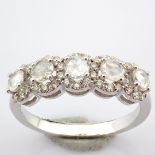 An exquisite 18K white gold ring detailed with fancy and brilliant cut diamonds