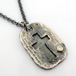 Cross necklace detailed with brilliant diamonds and 18k gold on silver