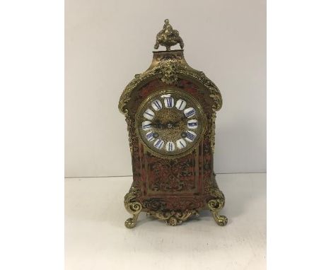 A 19th Century brass and tortoiseshell boulle work cased mantel clock, the eight day movement by Japy Frères of Paris with en