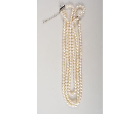 Three row freshwater pearl necklace, 42cm long, average size pearls, 5.5mm x 6.5mm.