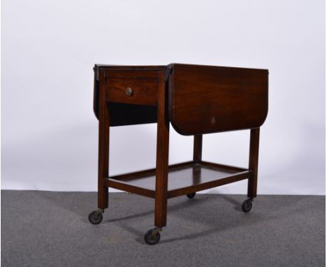 Oak trolly, rectangular top with rounded corners and two fall leaves, shelf under, length 71cm.