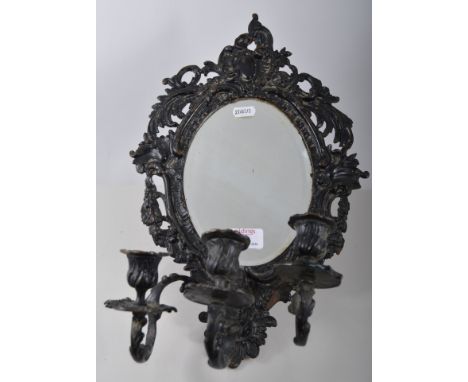 Brass ships light on gimble (converted), and a cast metal mirror with three light candle sconce, (2).
