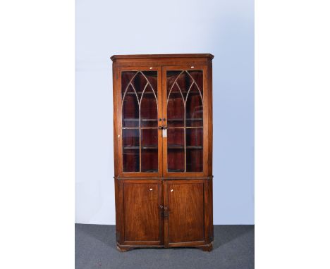 Victorian mahogany freestanding corner cabinet, cavetto moulded cornice, lancet glazed doors enclosing three fixed shelves, c