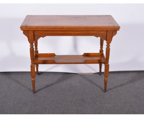 Late Victorian oak card table, rectangular fold over top with a moulded edge enclosing a baize lined interior, carved frieze,