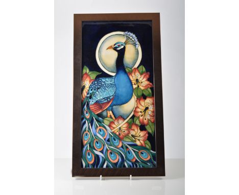 Moorcroft plaque in the Peacock design, 45cm x 24cm, by R J Bishop 2007, in bronzed metal frame.