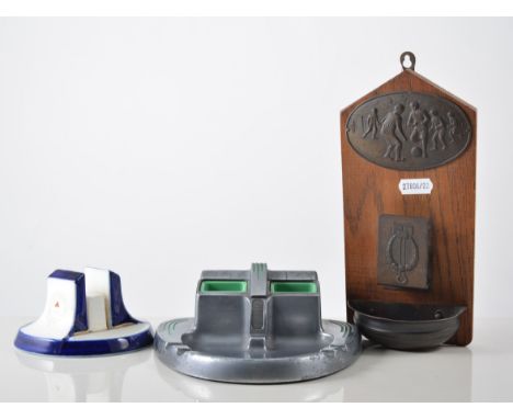 Six matchbox holders and strikers, an Art Deco Joseph Lucas "King of the Road" metal ashtray with sliding top revealing a pai
