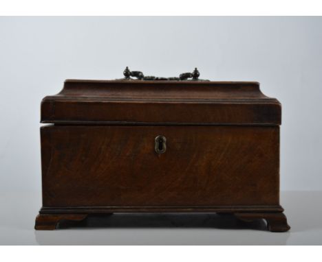 Georgian mahogany tea caddy, sarcophagus top enclosing three compartments, ogee bracket feet, width 25cm.