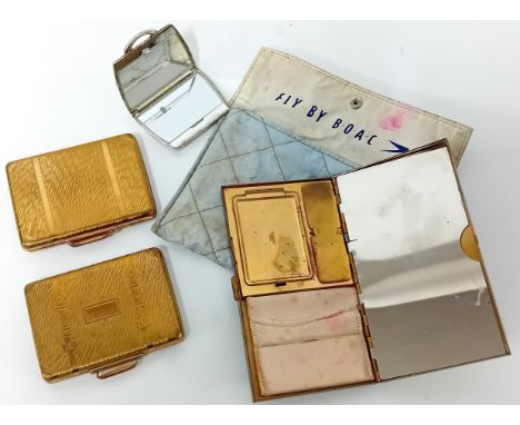 A collection of vanity cases, presented by BOAC Airlines to its first class passengers, one in a 'Fly by BOAC' quilt pocket, 