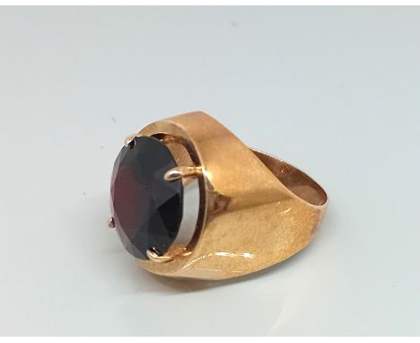 A gold gents ring, set with garnet type stone, total weight 6.2g, hallmark rubbed, size K