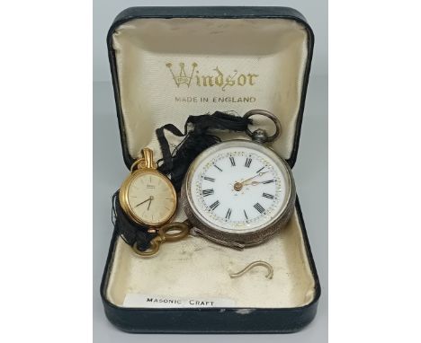 A silver pocket watch, engraved decoration with enamel dial and gilt details and hands, together with a small Seiko pocket wa