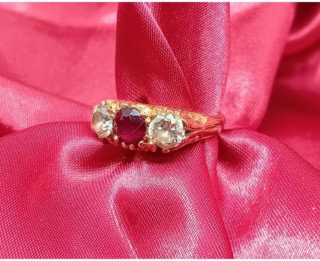 An 18ct yellow gold ring set with ruby and diamond, approx 5.9g, size K.