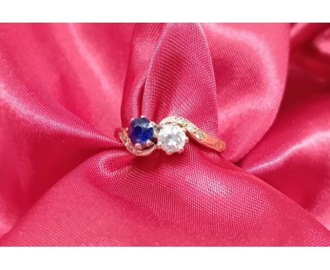 An 18ct yellow gold ring set with diamond and sapphire, approx 3.1g, size K/L.