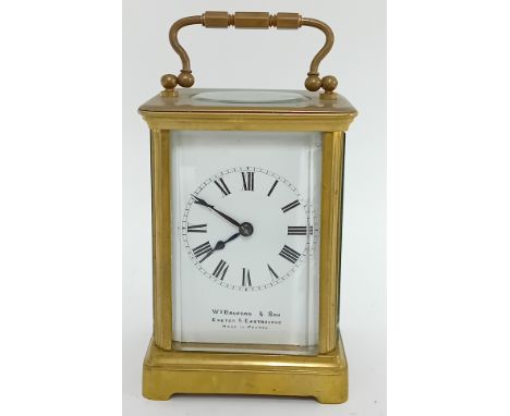 A brass carriage clock by William Bruford and Son of Exeter and Eastbourne, made in France, Roman enamel dial, front glass lo