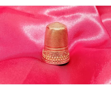 A yellow metal thimble (unmarked), approx 4.4g.