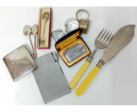 A collection of silver plated items, to include a fish slice and fork, cigarette cases, napkin rings, spoons.
