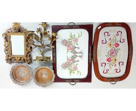 Two embroidered silk framed trays, together with a pair of gilt frames, gilt floral candelabra, and a pair of bottle coasters
