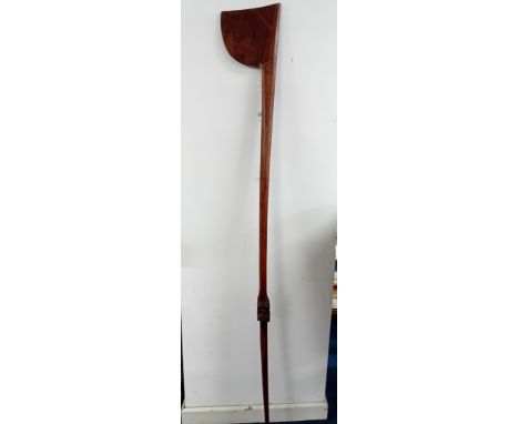 A New Zealand Māori Tewhatewha carved wood long club, possibly late 19th/early 20th century, the axe-like blade with pierced 