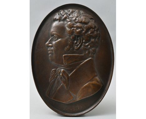 Wandplakette mit Bildnis des Komponisten Franz Schubert, wohl Bildgießerei Lauchhammer, 1.Viertel 20. Jh. Bronzeguss, patinie