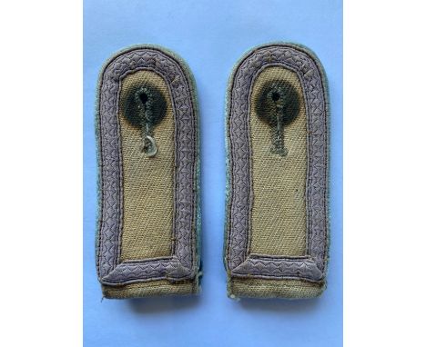 A pair of Second World War German Afrikakorps Shoulder Straps, sand coloured material, with pale brown braid and pale green p