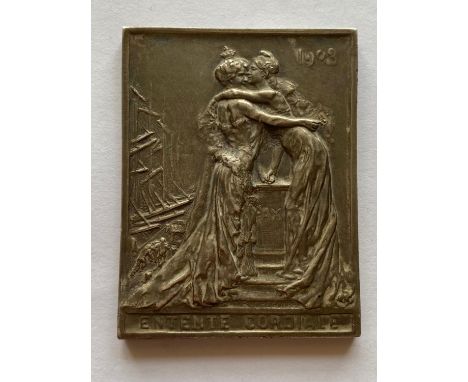 A Rectangular silver medal by R. Gregoire, decorated in low relief with female figures representing Britain and France embrac