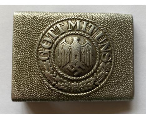 A Second World War German Army Belt buckle, an early aluminium pebbled design type with an Eagle to the center and 'Gott mit 