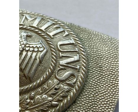 A Second World War German Army Belt buckle, of early two-piece aluminium manufacture, with an eagle to the center and ‘Gott m