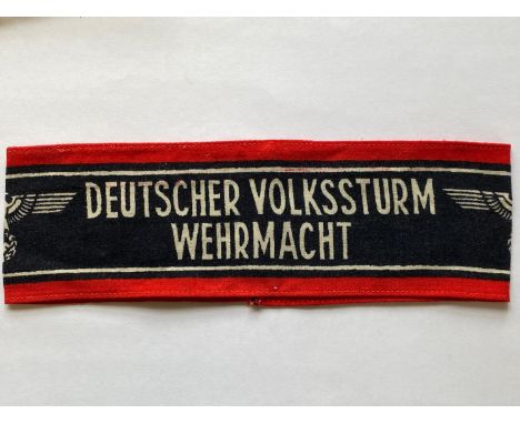 A Second World War German Home Guard Deutscher Volksturm Armband. Printed cotton type with a central black band with white 'D