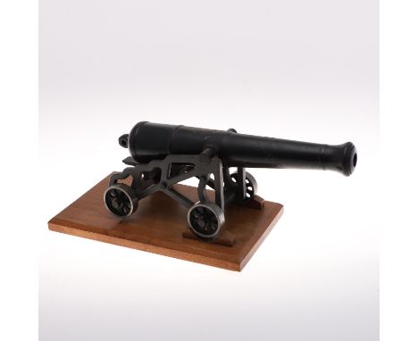 A finely manufactured model of a 19th century 32 pounder cannon of the Crimea period on a garrison carriage with four wheels,