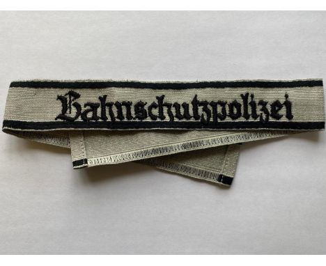 A Second World War German Bahnschutzpolizei Cuffband (Railway Police). With silver wire stripe and black cotton border to the