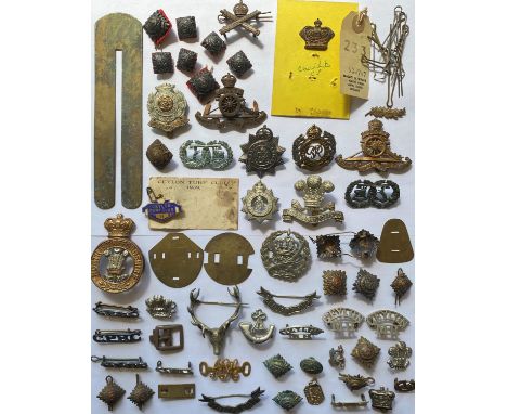 A collection cap badges to include the Hampshire Regiment, Royal Engineers, Royal Artillery, Argyll and Sutherland Highlander