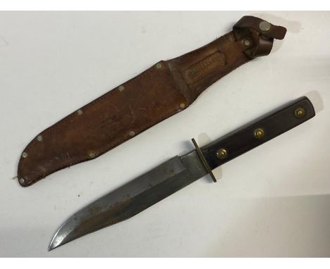 A large German Bowie Knife with an 18cm shaped blade with bowie point, the blade marked Solingen Germany, with a two part dar