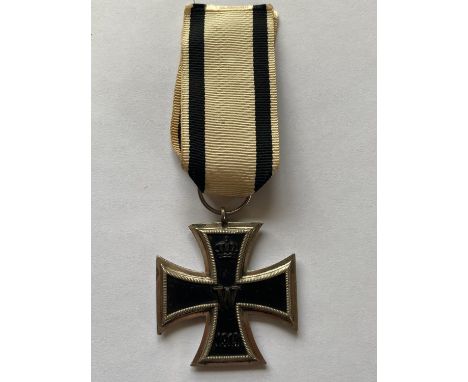 A Prussian Iron Cross 2nd Class, 1914.  Unusual variant for a non-combatant with a white ribbon with 2 black stripes.  *CR:  