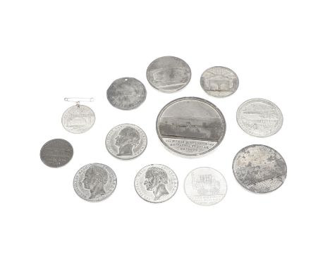 A collection of twelve engineering related white metal medals including a 6.5cm medal 'The Menai Straits Suspension and Brita