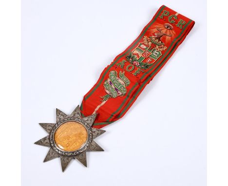 An early Victorian Ancient Order of Foresters medal in unmarked white metal with a ten pointed star with gilt centre under gl