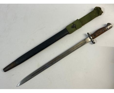 A Bayonet and scabbard with a 43.5cm single edged fullered blade with marks marks including 'Wilkinson' '19' 'X' and other pr