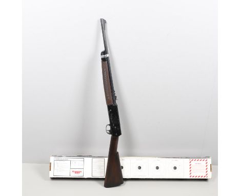 A Crossman 2200 Magnum model 2200 .22 pneumatic air rifle by Crossman Arms, Fairport, New York, 99cm overall. With original p