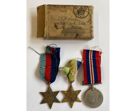 A Second World War group of three comprising 1939-45 and Atlantic Stars and War Medal, unnamed as issued, in cardboard delive