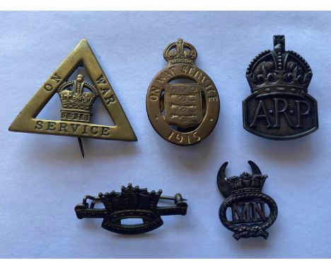 On War Service Badges for 1915 and 1916 Ministry of  Munitions workers. 1915 Second pattern number 13372 by Mappin and Webb. 