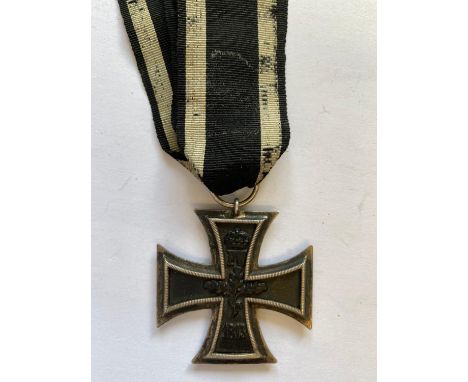 A German Iron Cross 2nd Class, on black and white ribbon dated 1813 to the reverse, 1914 to the obverse. Early 20th century o