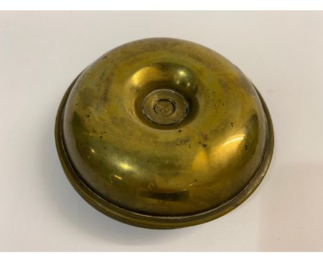 A two part brass travelling or campaign candlestick, the two circular sections with detachable sconces, screwing together at 