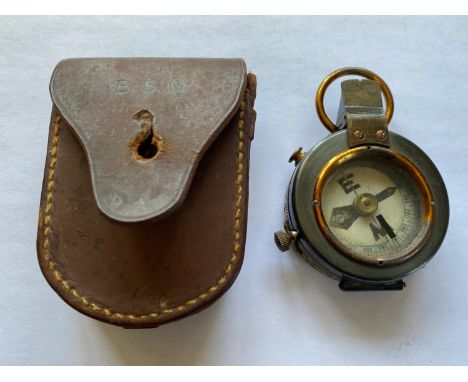 A military compass marked for Negretti and Zambra of London, with two sets of scratched initials BSG and B.S.Gibbon, the leat