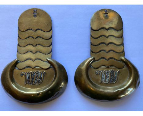 A pair of brass epauletts or shoulder scales, with WSY to the horse shoe shaped shoulder, Private's epauletts for the West So