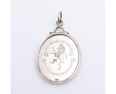A silver award medal finely engraved with a crowned lion rampant within motto 'God Keep the King and the Craft' 'The Seven In