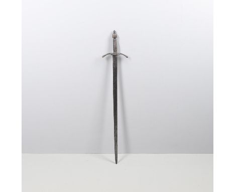 The 79cm straight blade with shallow full length fuller, rounded tip and sharpened blade, sharpened on both sides at the tip.