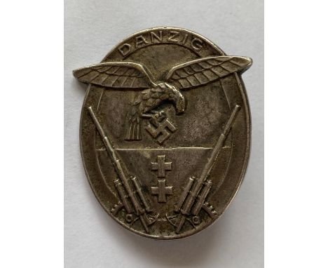 A Second World War German Luftwaffe Danzig Flak Badge, white metal, with a 'LW' eagle above the Danzig coat of arms, and 88mm